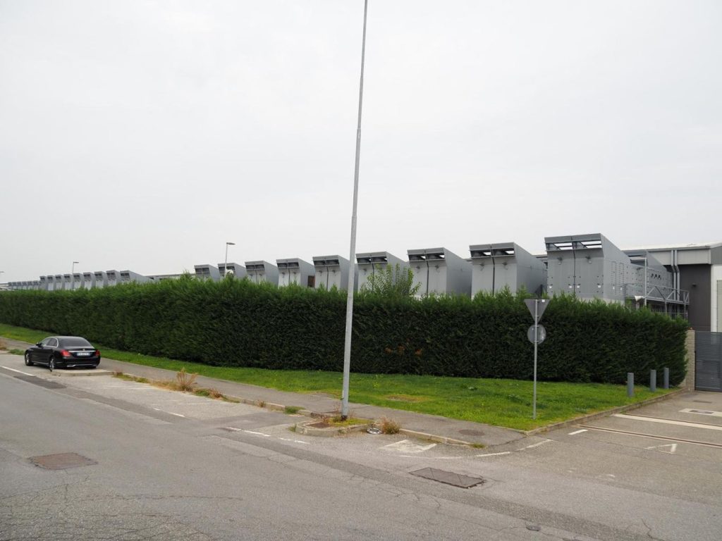 Data Centre Operators Race to Train the Engineers They Cannot Hire engineer working among rows of data centre servers